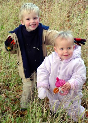 Joshua and Misha having fun in the autumn grasses