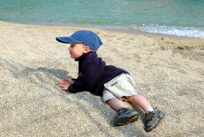Joshua lying on the beach in Monaco