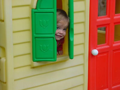 Peeka-boo.  Misha enjoying the play house.