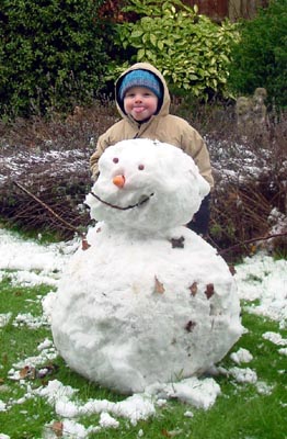 Joshua posing with his snowman
