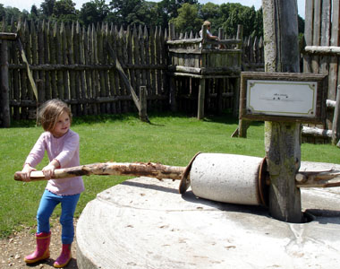 Misha tries her hand at the flour mill at Mt Fitchet castle