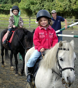 Horse riding at a nearby farm.  The children go once a week.