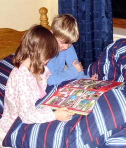 Joshua and Misha reading together before bed