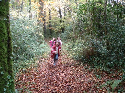 Misha running through the forest with  Carmen and Mikyla