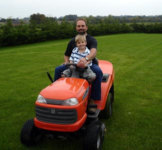 Joshua trying his hand at the tractor mower