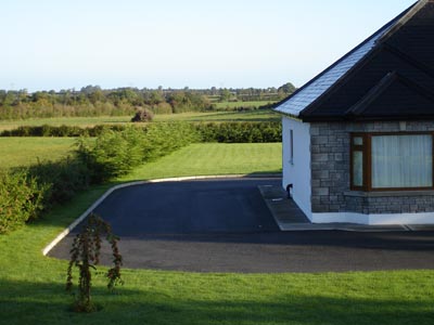 A glimpse past the house and into the fields beyond