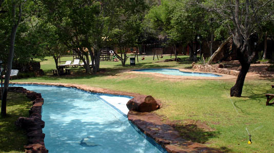 Another view of the pool and surrounding gardens