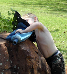 Joshua inspects the workings of a pool cleaner
