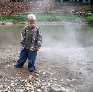 Joshua inspects the volcanic hot spring