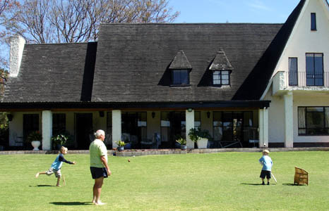 John, Joshua & Roger enjoy a game of cricket at Tim & Susan's lovely house