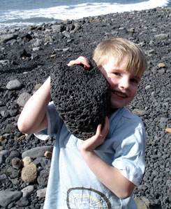 Joshua in his element with a chunk of volcanic rock
