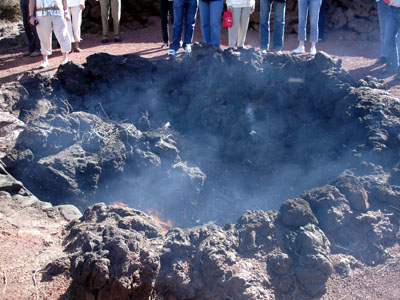 The temperature just a foot or so below the ground on Timanfaya is such that a dry tumbleweed shoved into a hole bursts into flame within a minute.
