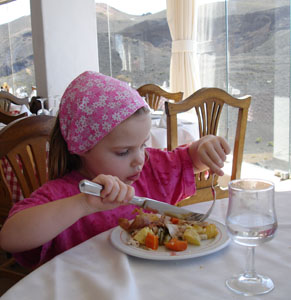 Misha tucking into some chicken cooked over the volcano.  What a treat that was!