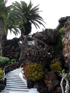 An ornate staircase built out of volcanic rocks at Jameos del Agua