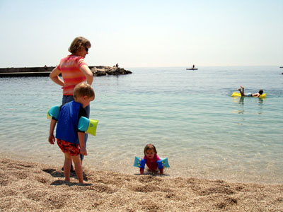 Misha & Joshua enjoying a swim at the beach in Monaco