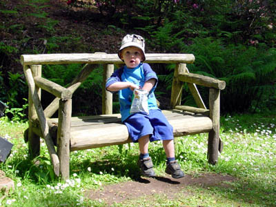 Joshua stopping for a snack in the grounds of Muncaster Castle