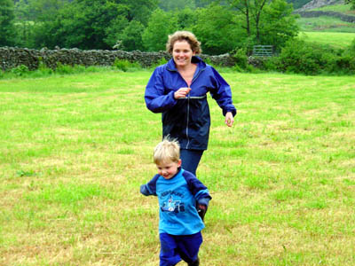 Mandy and Joshua play a game of catch in a field