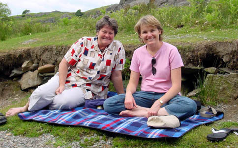 Mandy and Linda relax while Stef take the kids for a plunge in the river