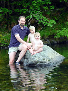 Perched on a rock in a nearby river.