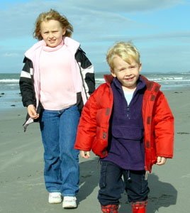 Joshua and Jessica enjoy a stroll on the beach