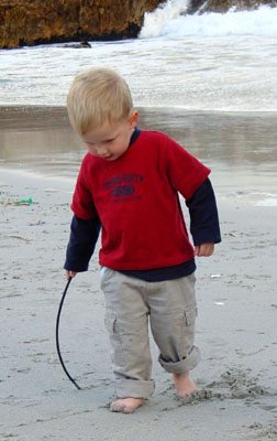 Joshua drawing circles in the sand, Lang Baai, Hermanus