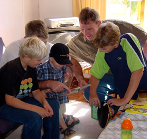Enjoying the attention from cousins and uncles