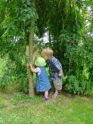 Joshua gives Misha a kiss under a weeping tree in Bath.